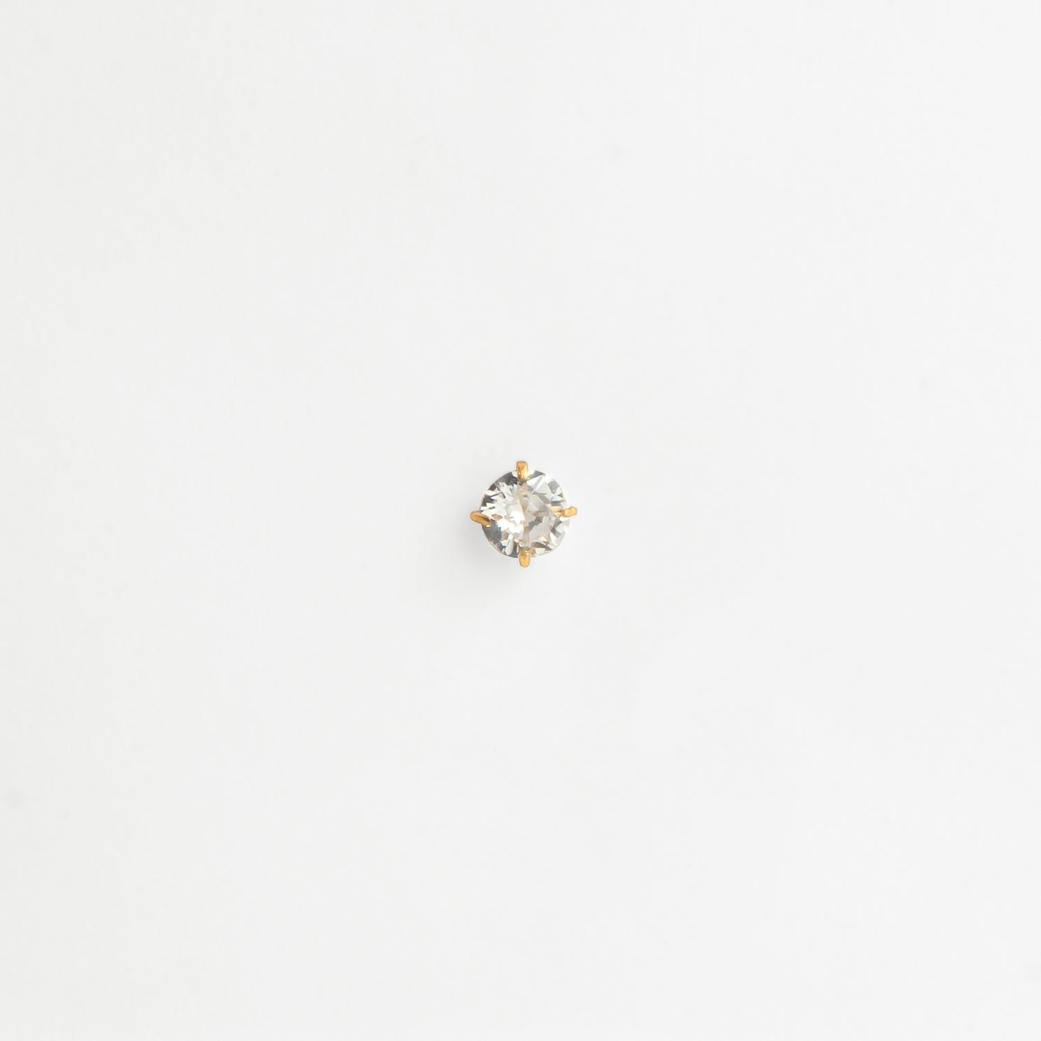 Piercing titane doré zircon