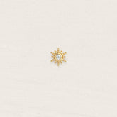 Piercing threadless plaqué or tige titane motif soleil avec zircon blanc
