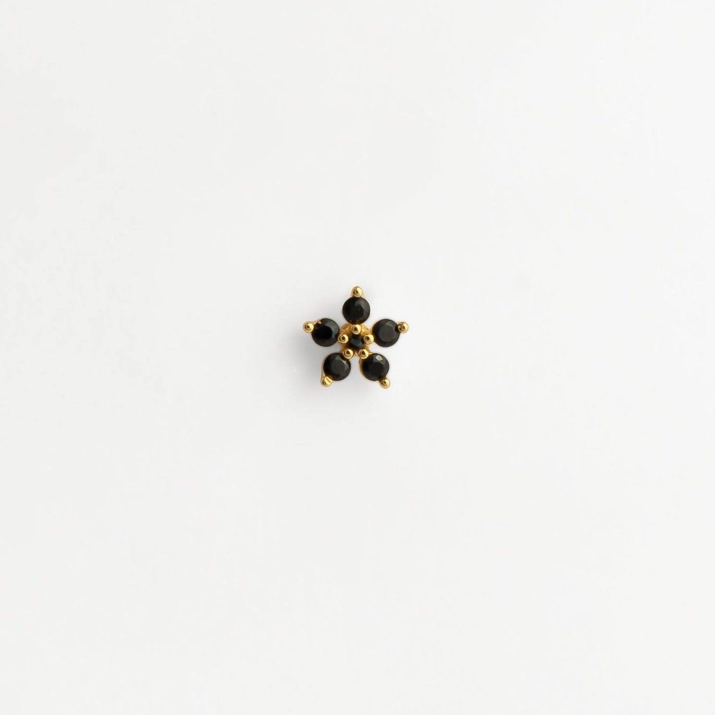 Piercing acier inoxydable doré pierre zircons noirs